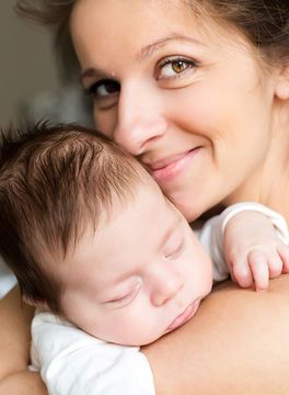 mother-cuddling-baby_700x700_shutterstock_131776571